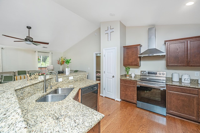 kitchen with light stone counters, sink, electric stove, wall chimney range hood, and dishwasher