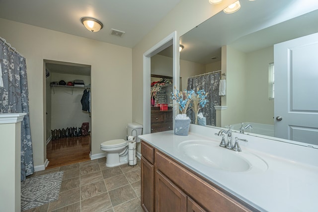 bathroom with vanity and toilet