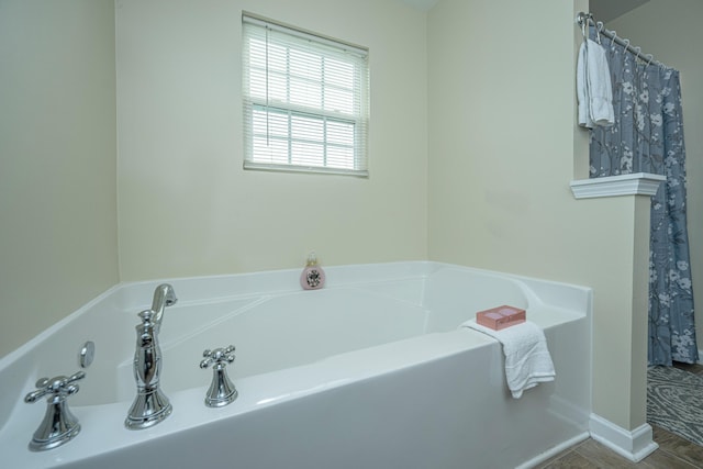 bathroom featuring a bath