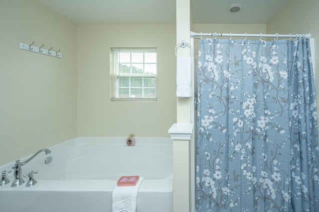 bathroom with a tub