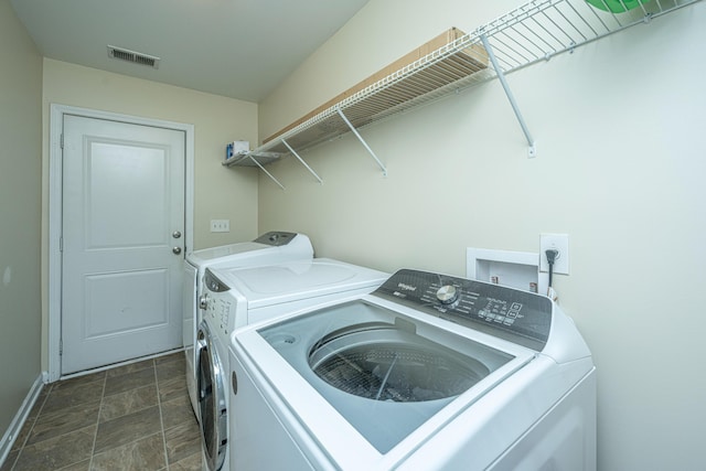 laundry area with separate washer and dryer