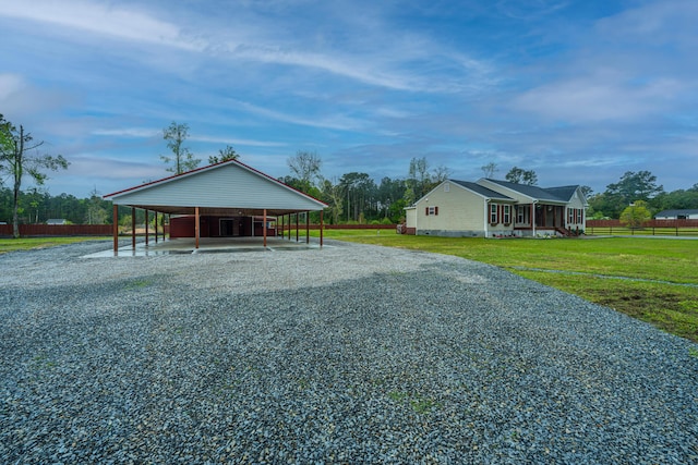 exterior space with a front yard and a carport