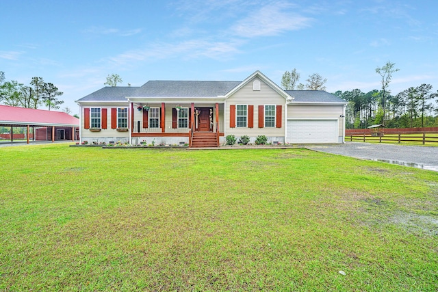 ranch-style house featuring covered porch, a garage, and a front lawn