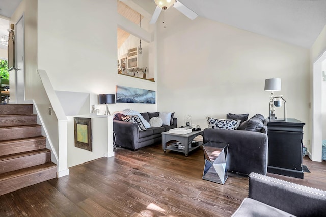 living room with ceiling fan, dark hardwood / wood-style floors, and high vaulted ceiling