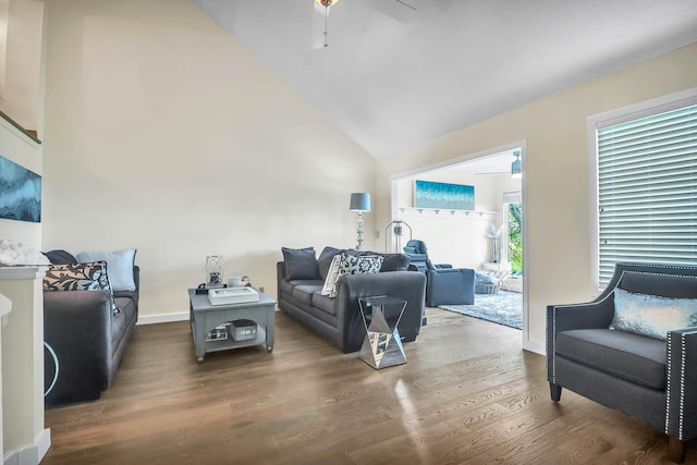 living room featuring ceiling fan, high vaulted ceiling, and dark hardwood / wood-style floors