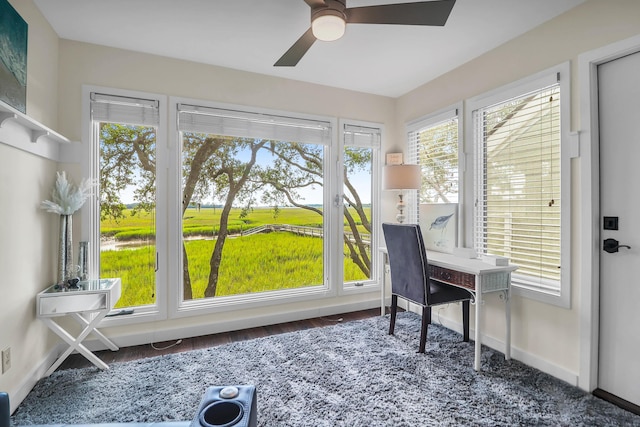 sunroom with a wealth of natural light and ceiling fan