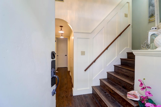 staircase featuring hardwood / wood-style floors