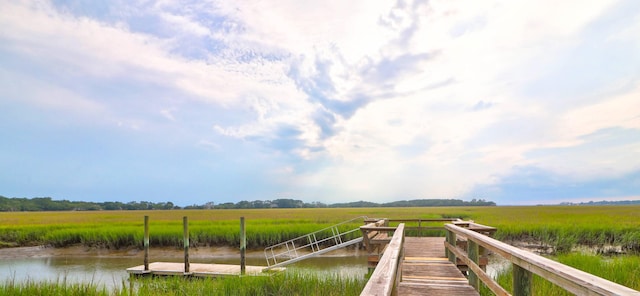 dock area with a water view and a rural view