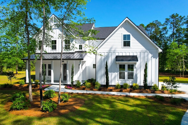 202 Countryside Way, Summerville, SC 29483 - modern farmhouse with board and batten siding, a porch, a standing seam roof, and a front yard