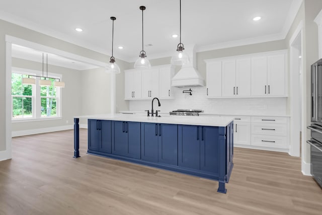 202 Countryside Way, Summerville, SC 29483 - kitchen with light countertops, a kitchen breakfast bar, light wood-style flooring, white cabinetry, and decorative backsplash