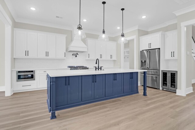202 Countryside Way, Summerville, SC 29483 - kitchen featuring light countertops, appliances with stainless steel finishes, ornamental molding, and light wood-type flooring