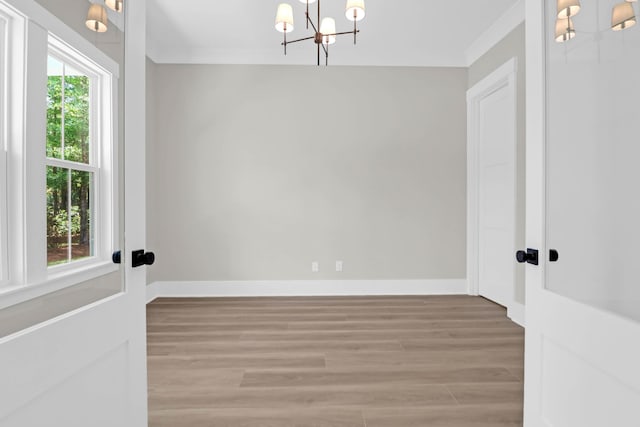 202 Countryside Way, Summerville, SC 29483 - unfurnished room featuring crown molding, baseboards, a notable chandelier, and light wood-style flooring