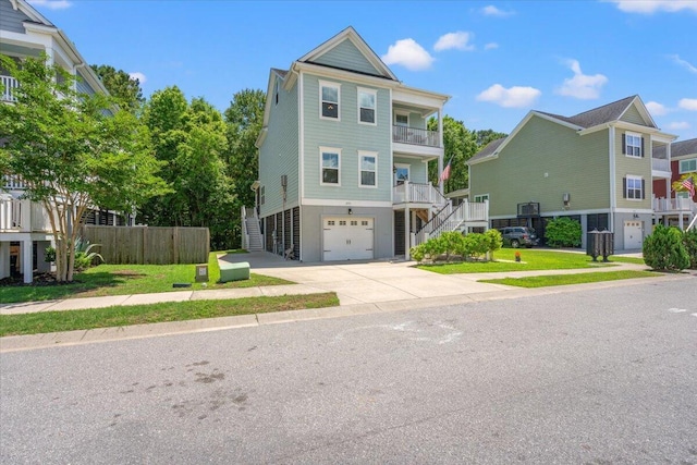 3751 Copahee Sound Dr, Mount Pleasant, SC 29466 - view of front of house with stairs, an attached garage, concrete driveway, and a balcony