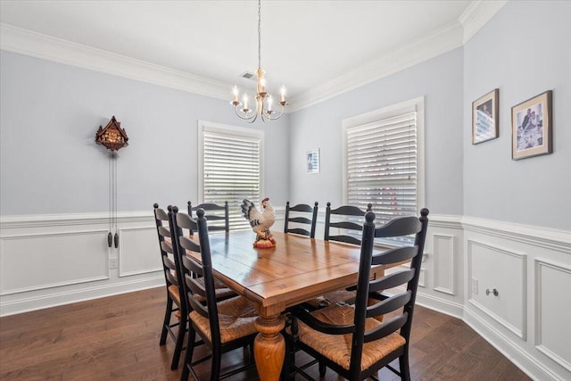 3751 Copahee Sound Dr, Mount Pleasant, SC 29466 - dining area with a chandelier, crown molding, dark wood-type flooring, wainscoting, and a decorative wall