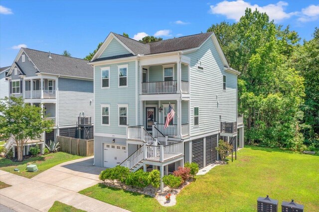 3751 Copahee Sound Dr, Mount Pleasant, SC 29466 - coastal inspired home with stairway, a balcony, driveway, an attached garage, and a front lawn