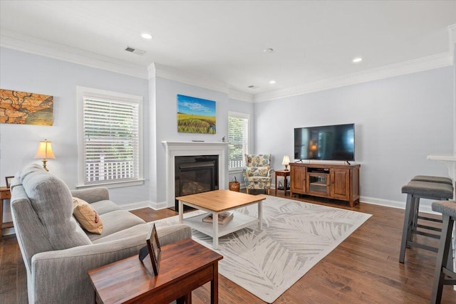 3751 Copahee Sound Dr, Mount Pleasant, SC 29466 - living room with crown molding, a glass covered fireplace, recessed lighting, dark wood finished floors, and baseboards