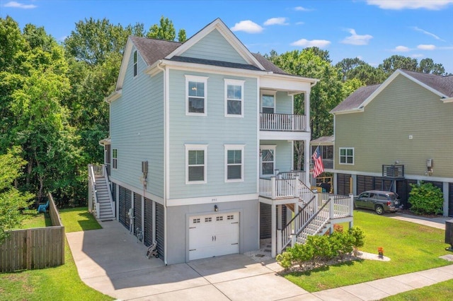 3751 Copahee Sound Dr, Mount Pleasant, SC 29466 - view of front of property with stairway, a garage, driveway, a front lawn, and a balcony