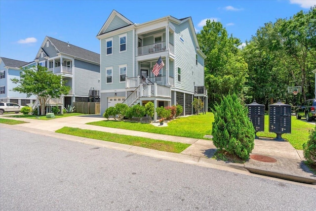 3751 Copahee Sound Dr, Mount Pleasant, SC 29466 - view of front of property featuring stairs, concrete driveway, an attached garage, a front yard, and a balcony