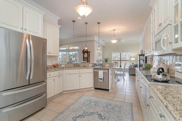 265 Venice Way Unit 1-201, Myrtle Beach, SC 29577 - kitchen with stainless steel appliances, white cabinetry, decorative backsplash, and decorative light fixtures