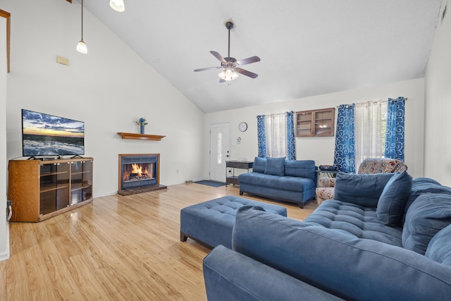 171 N Main St, Ridgeville, SC 29472 - living area featuring high vaulted ceiling, ceiling fan, light wood-style flooring, a fireplace, and baseboards