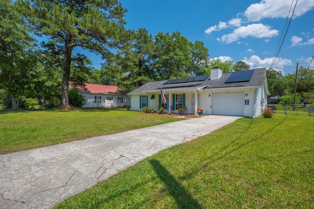 171 N Main St, Ridgeville, SC 29472 - ranch-style house with a porch, a garage, solar panels, driveway, and a chimney