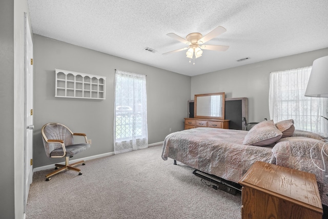 171 N Main St, Ridgeville, SC 29472 - bedroom featuring carpet floors, baseboards, a textured ceiling, and a ceiling fan