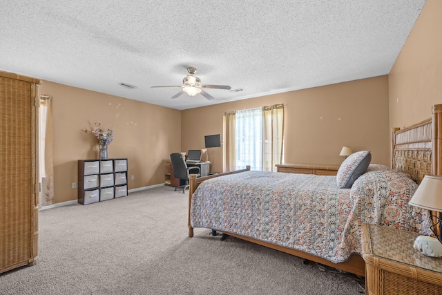 171 N Main St, Ridgeville, SC 29472 - carpeted bedroom with ceiling fan, a textured ceiling, and baseboards