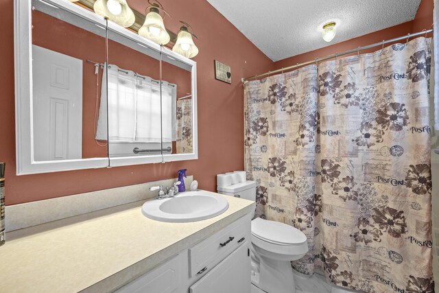 171 N Main St, Ridgeville, SC 29472 - bathroom with toilet, vanity, a textured ceiling, and curtained shower