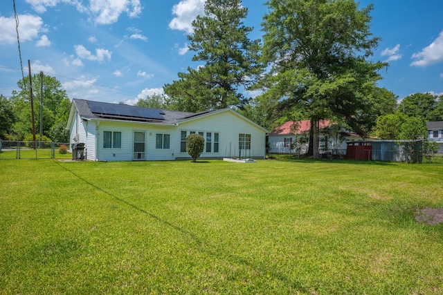 171 N Main St, Ridgeville, SC 29472 - rear view of property with solar panels and a shingled roof