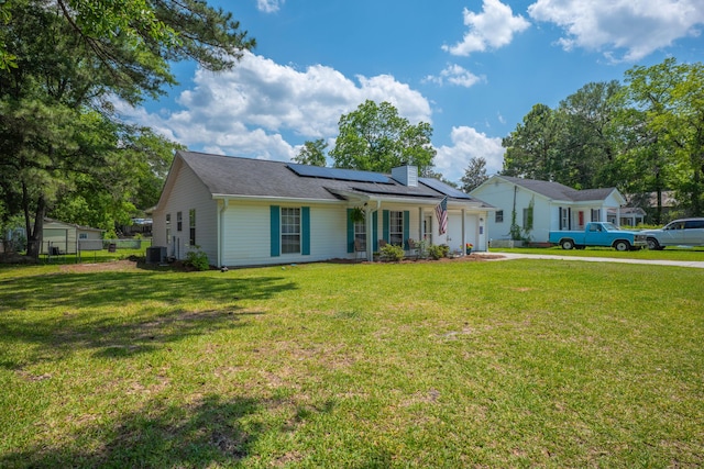 171 N Main St, Ridgeville, SC 29472 - ranch-style home with cooling unit, driveway, a garage, roof mounted solar panels, and a chimney