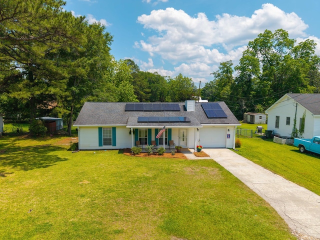171 N Main St, Ridgeville, SC 29472 - view of front of home featuring covered porch, solar panels, driveway, and a garage