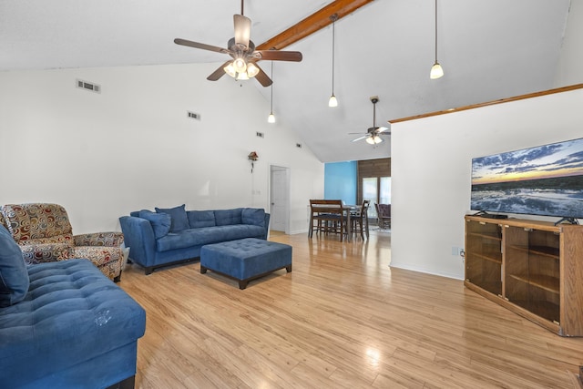 171 N Main St, Ridgeville, SC 29472 - living room with a ceiling fan, high vaulted ceiling, beam ceiling, light wood-style floors, and baseboards