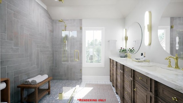 bathroom featuring plenty of natural light, tiled shower, a sink, and double vanity