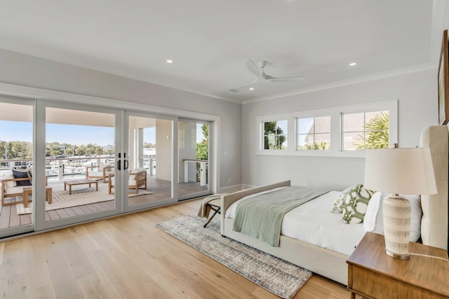 bedroom featuring access to outside, ornamental molding, light wood-style flooring, and recessed lighting