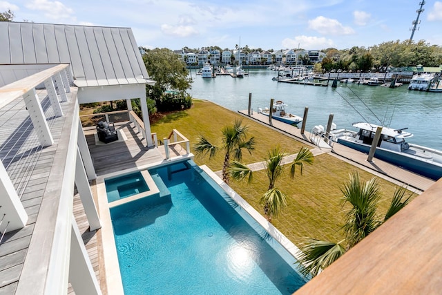 view of pool with a water view and a boat dock