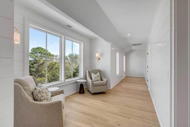 living area featuring light wood-style flooring, visible vents, and recessed lighting