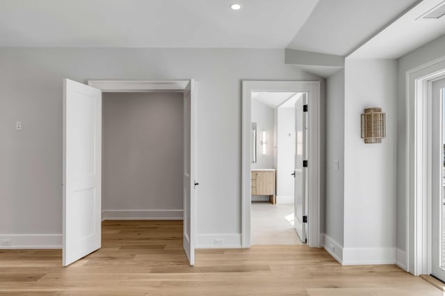 unfurnished bedroom with light wood-style floors, recessed lighting, visible vents, and baseboards