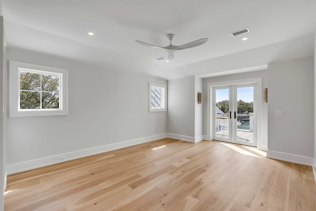 spare room with recessed lighting, a ceiling fan, visible vents, baseboards, and light wood-type flooring