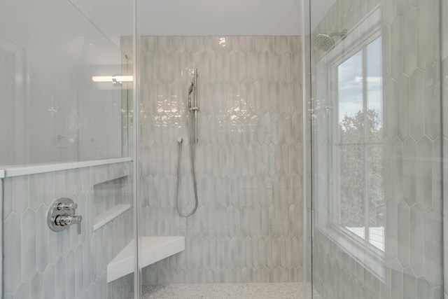 bathroom with tiled shower