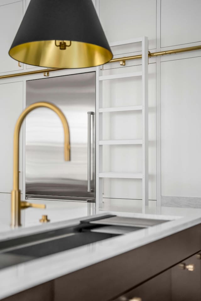 details featuring white cabinetry