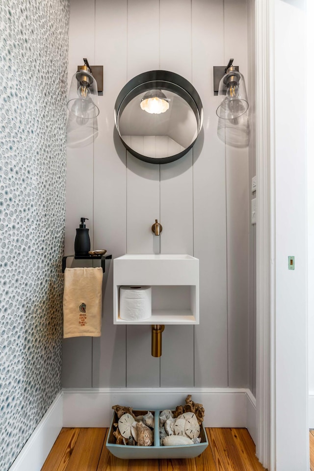 bathroom with wood-type flooring