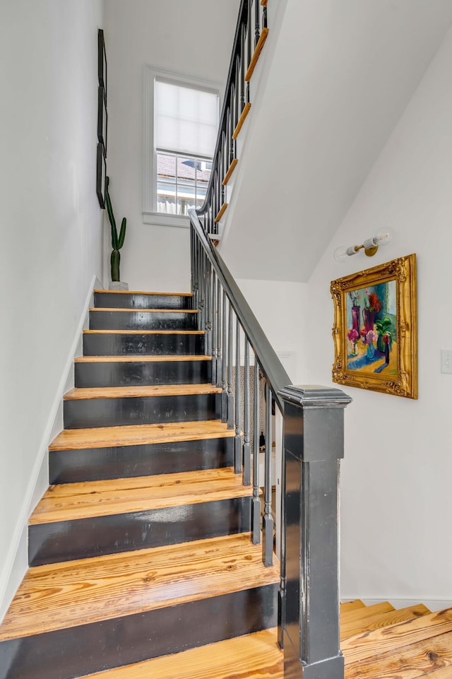 staircase featuring hardwood / wood-style floors