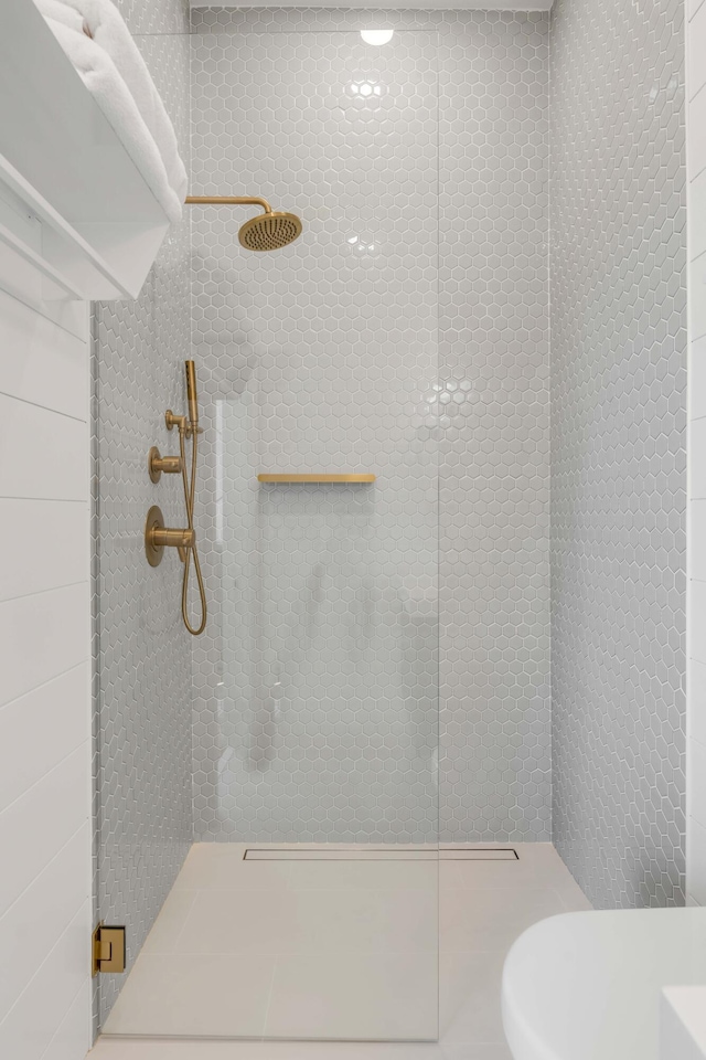 bathroom with tiled shower