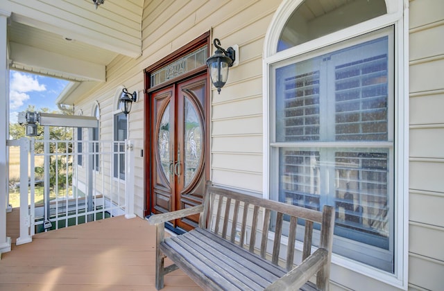 view of exterior entry featuring a porch