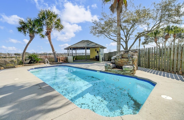 view of pool featuring a gazebo, a patio area, a fenced backyard, and a fenced in pool