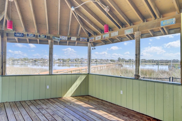 wooden deck featuring a water view