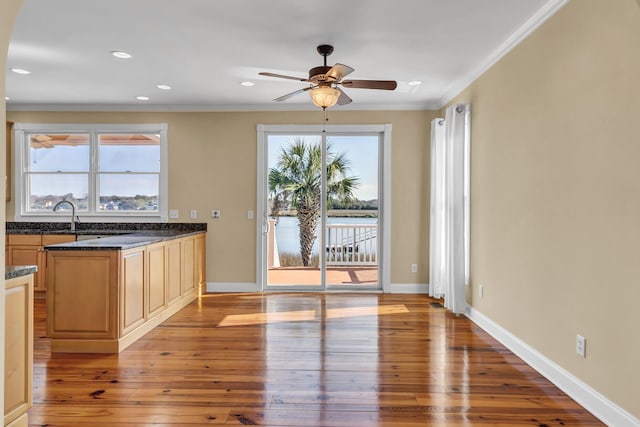 kitchen featuring recessed lighting, crown molding, light wood finished floors, baseboards, and ceiling fan