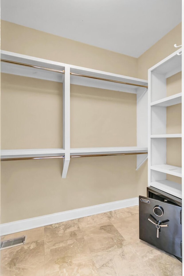 spacious closet featuring visible vents