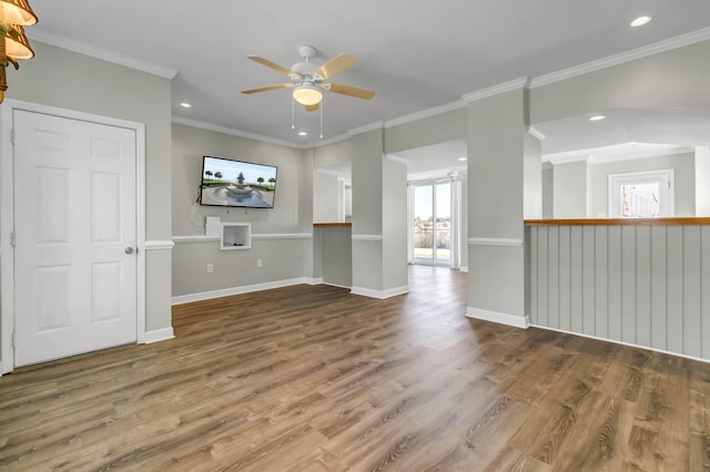 interior space with recessed lighting, crown molding, baseboards, and wood finished floors