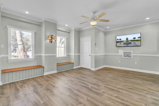 spare room with recessed lighting, baseboards, wood finished floors, and crown molding